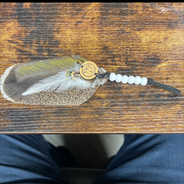 Hanging feather charm
